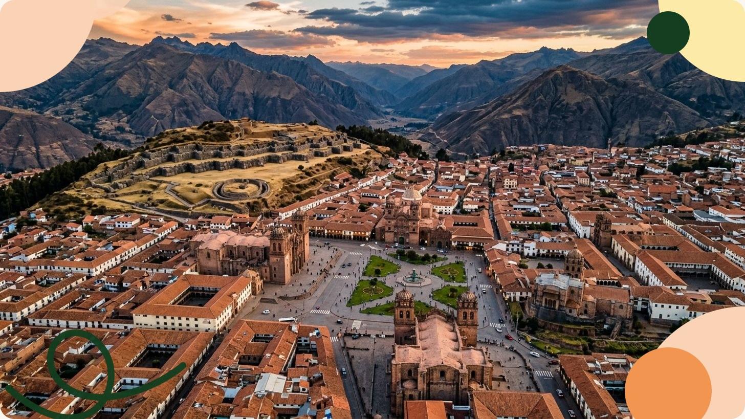 Aerial view of Cusco's Plaza de Armas with a baroque colonial cathedral, manicured gardens and a central fountain